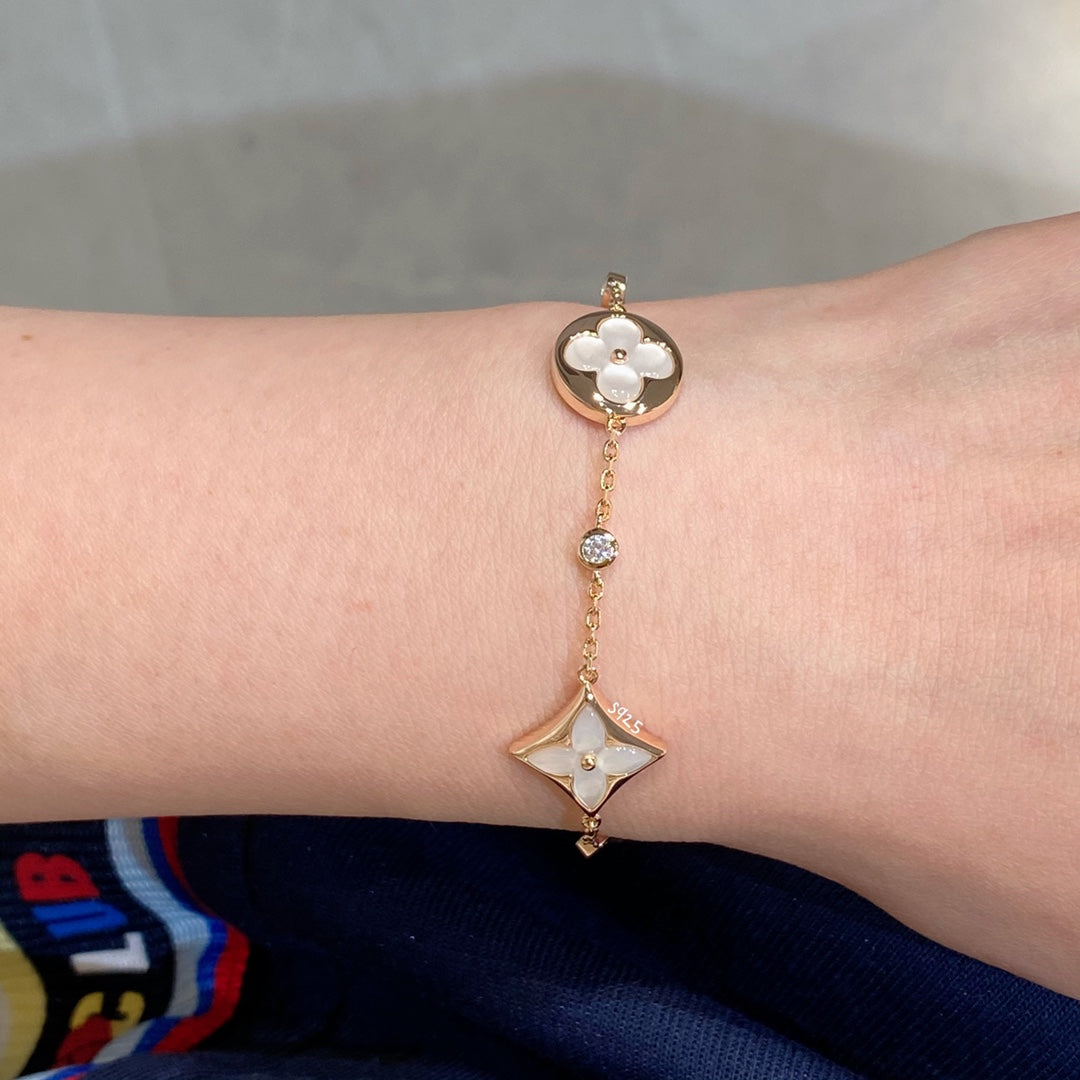 [Olivia JW]STAR AND SUN 4 MOTIF WHITE MOP PINK GOLD BRACELET
