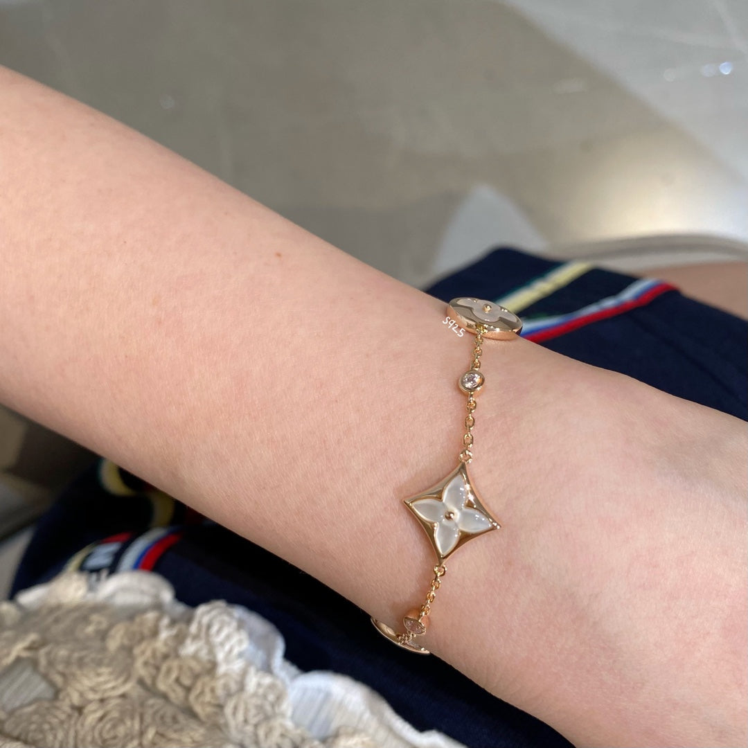 [Olivia JW]STAR AND SUN 4 MOTIF WHITE MOP PINK GOLD BRACELET