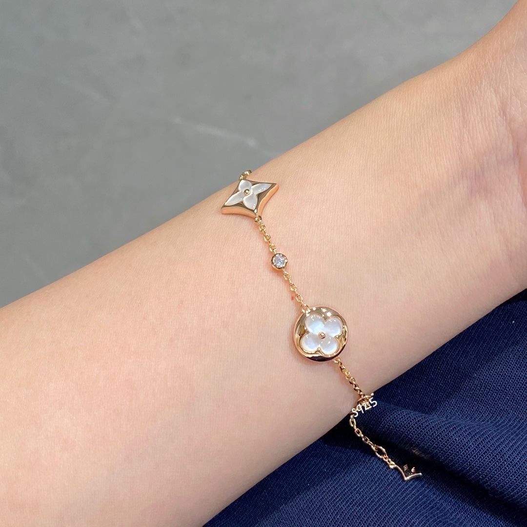 [Olivia JW]STAR AND SUN 4 MOTIF WHITE MOP PINK GOLD BRACELET