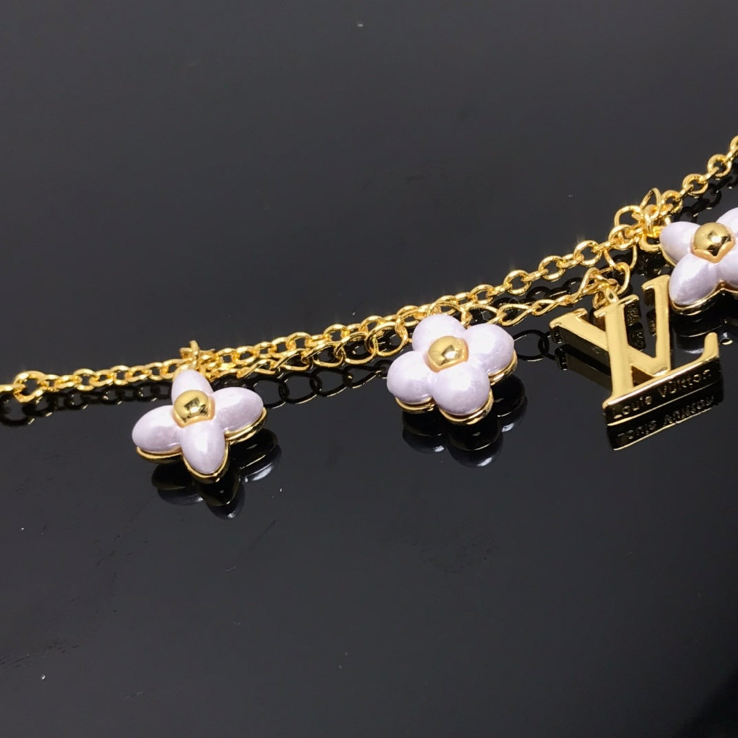[Olivia JW]LOGO 6 MOTIF STAR AND SUN GOLD BRACELET