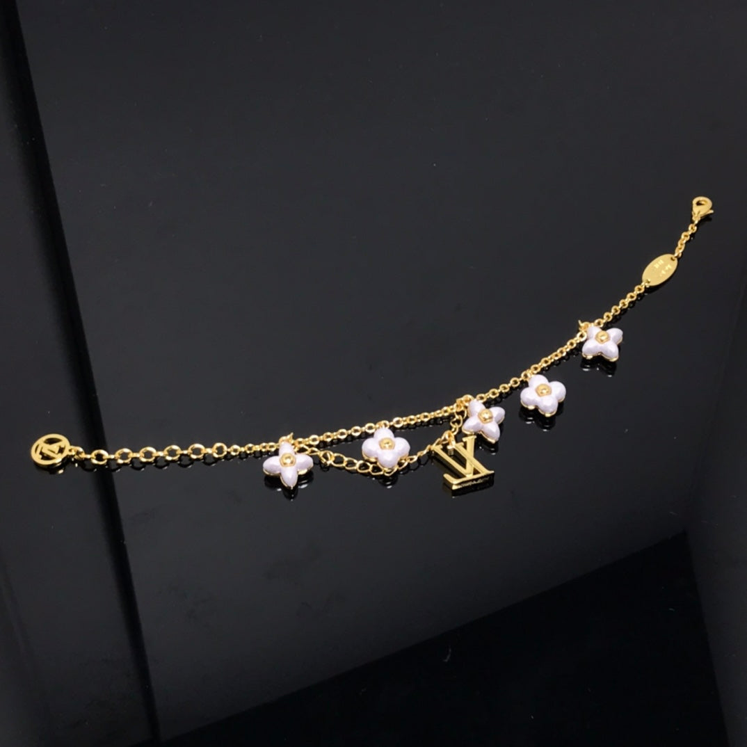 [Olivia JW]LOGO 6 MOTIF STAR AND SUN GOLD BRACELET